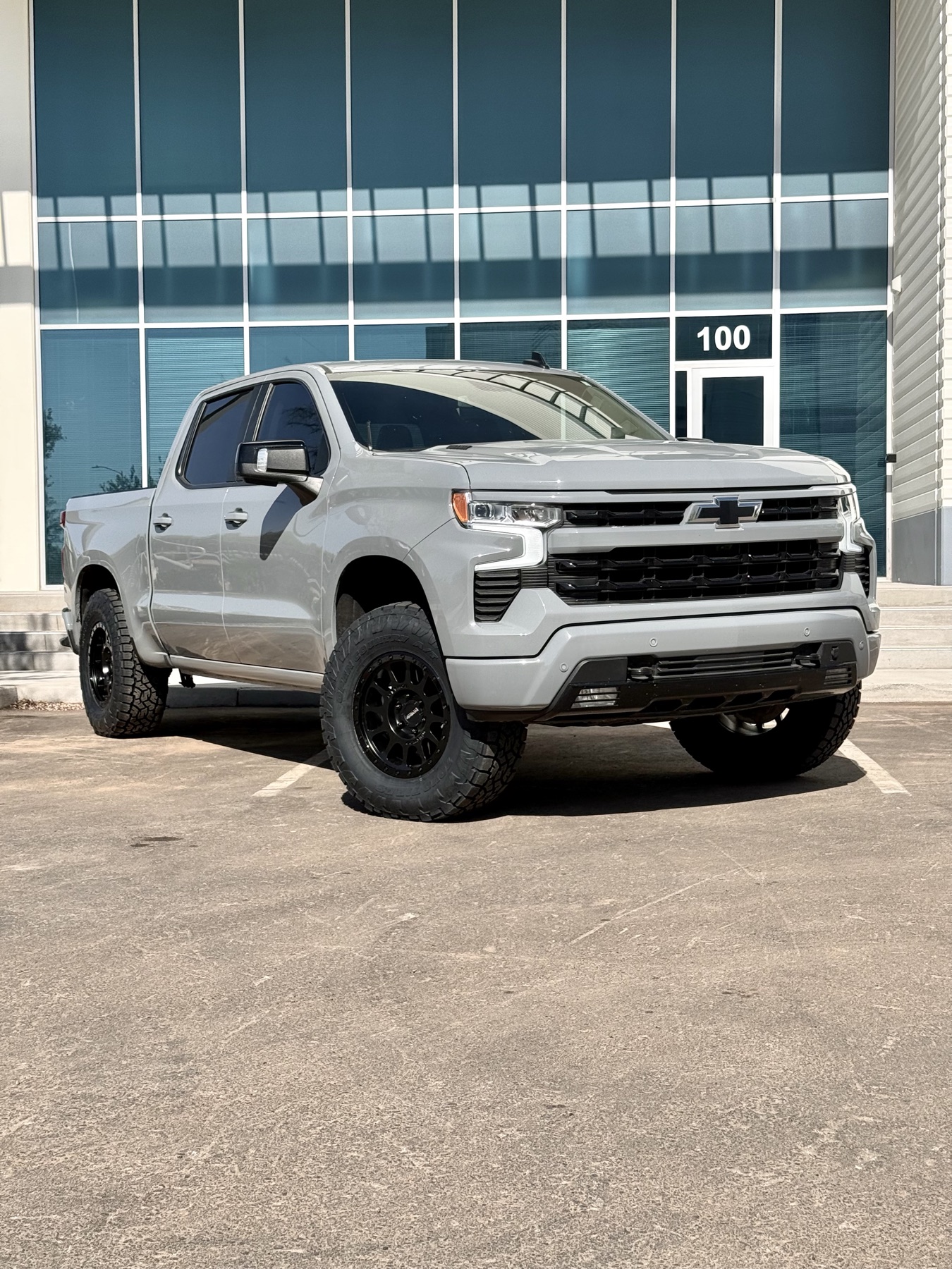 Gray Chevy Silverado RST lifted, clean factory-matched finish