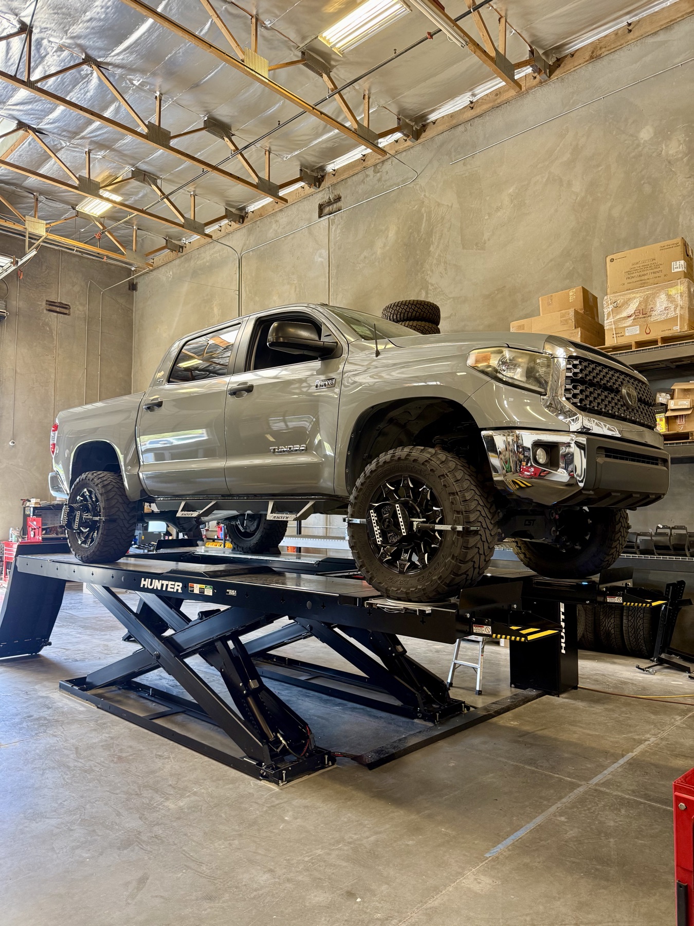 Toyota Tundra on the Hunter alignment rack inside the Kreative Design shop