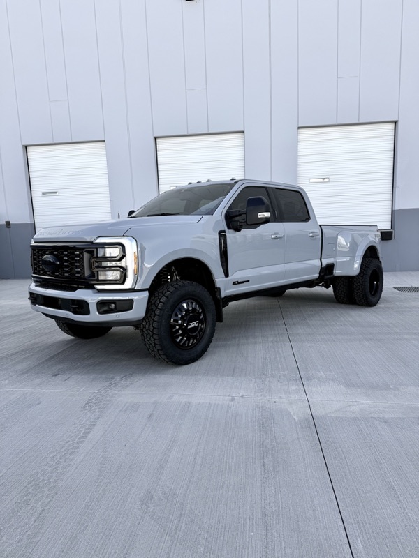 Silver Ford F-350 dually lifted